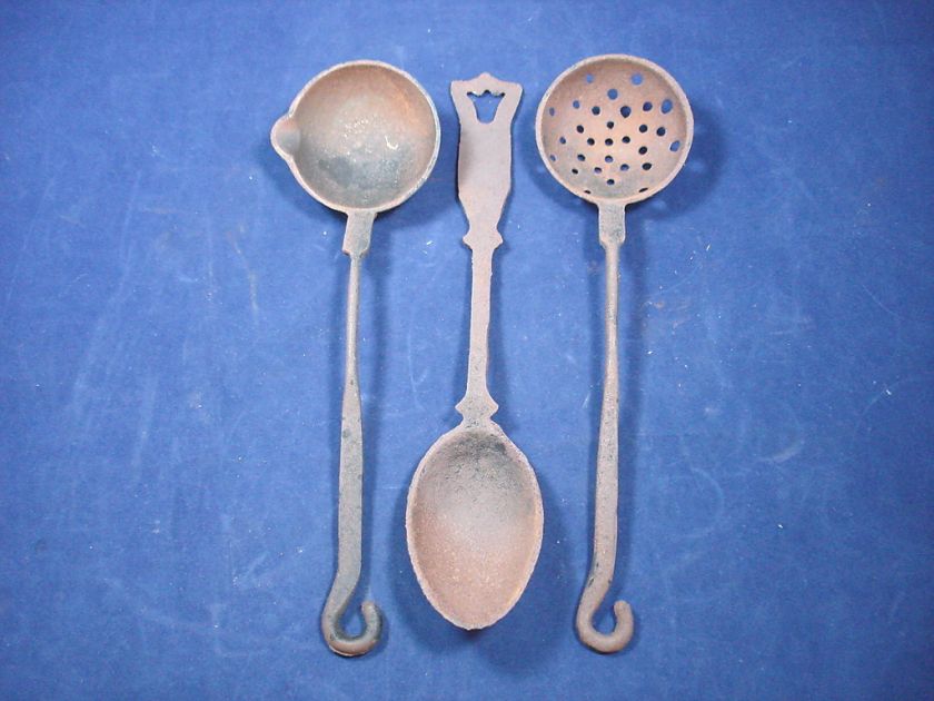 Cast Iron Utensils Measuring about 10 1/2 long Marked in Tiawan 