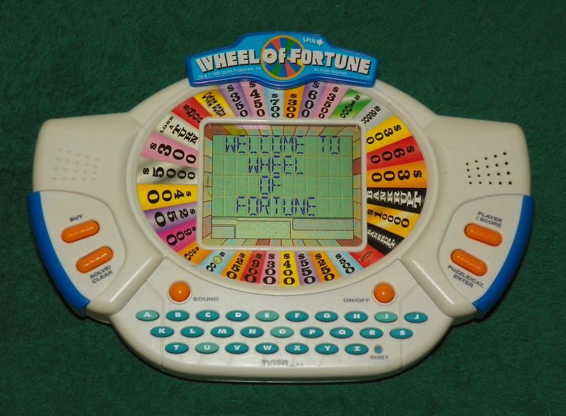 TIGER   POCKET WHEEL OF FORTUNE DELUXE HANDHELD GAME  